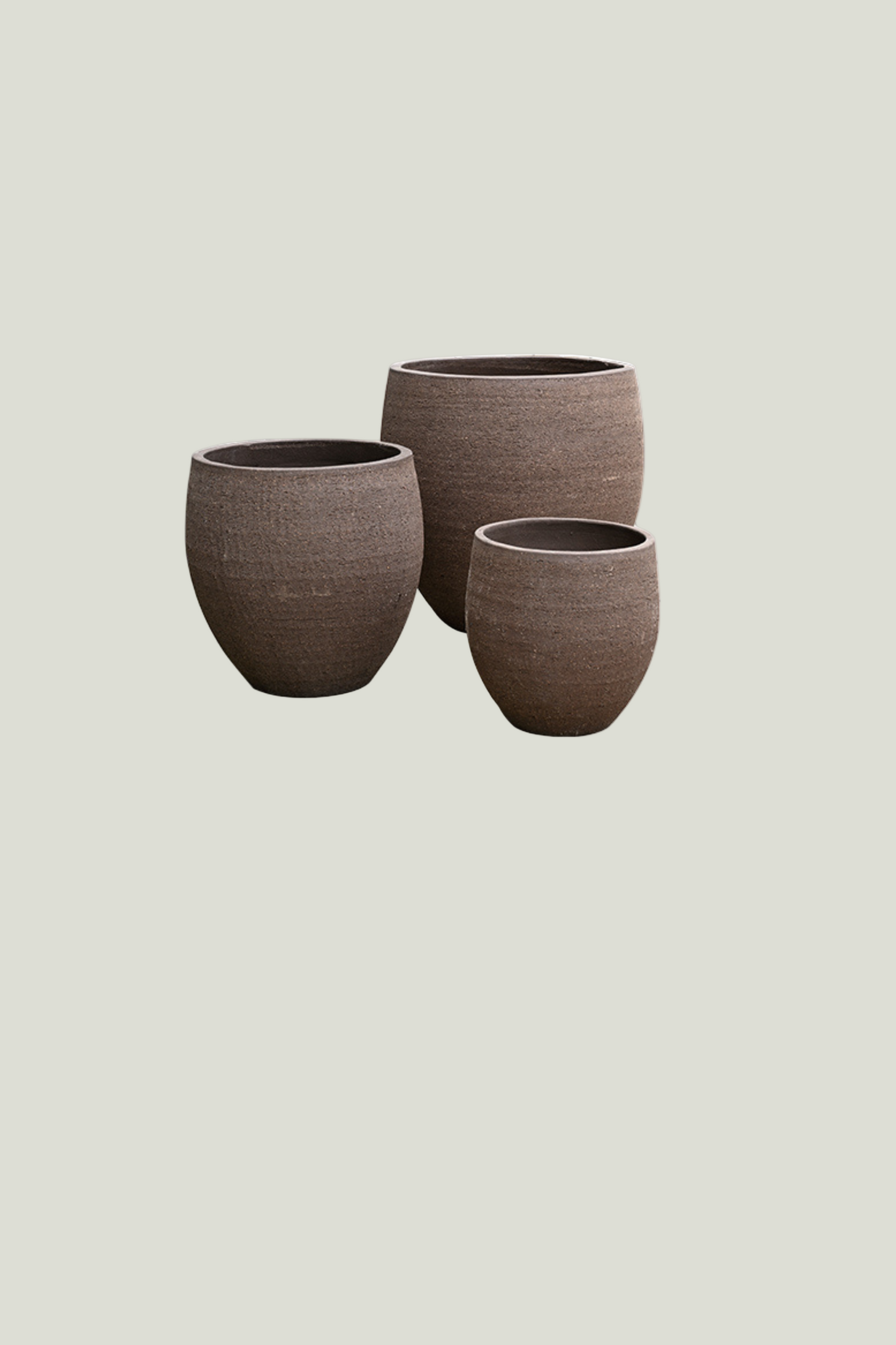 Three brown textured planters of different sizes