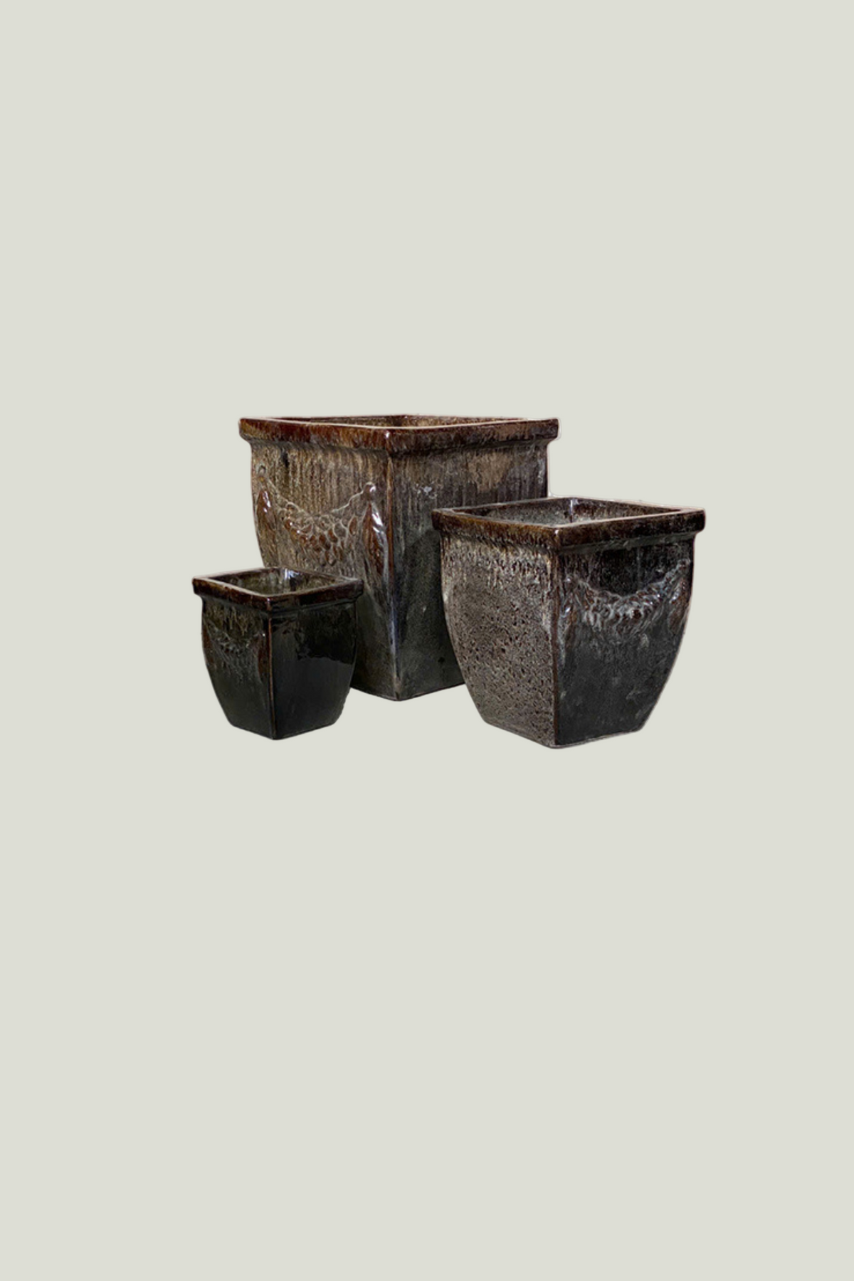 Set of three textured dark-toned planters