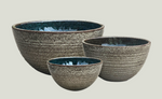 Set of three ceramic bowls with textured finish