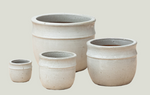 Set of four ceramic pots of varying sizes