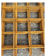 A stack of steel reinforcement mesh on crushed rock base