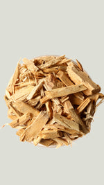 Wooden chips in a small container on a white background