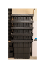 Stack of black plastic stormwater pits on a white background