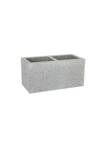 A rectangular besser block used in construction