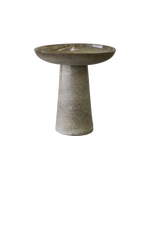 A brown hued bird bath