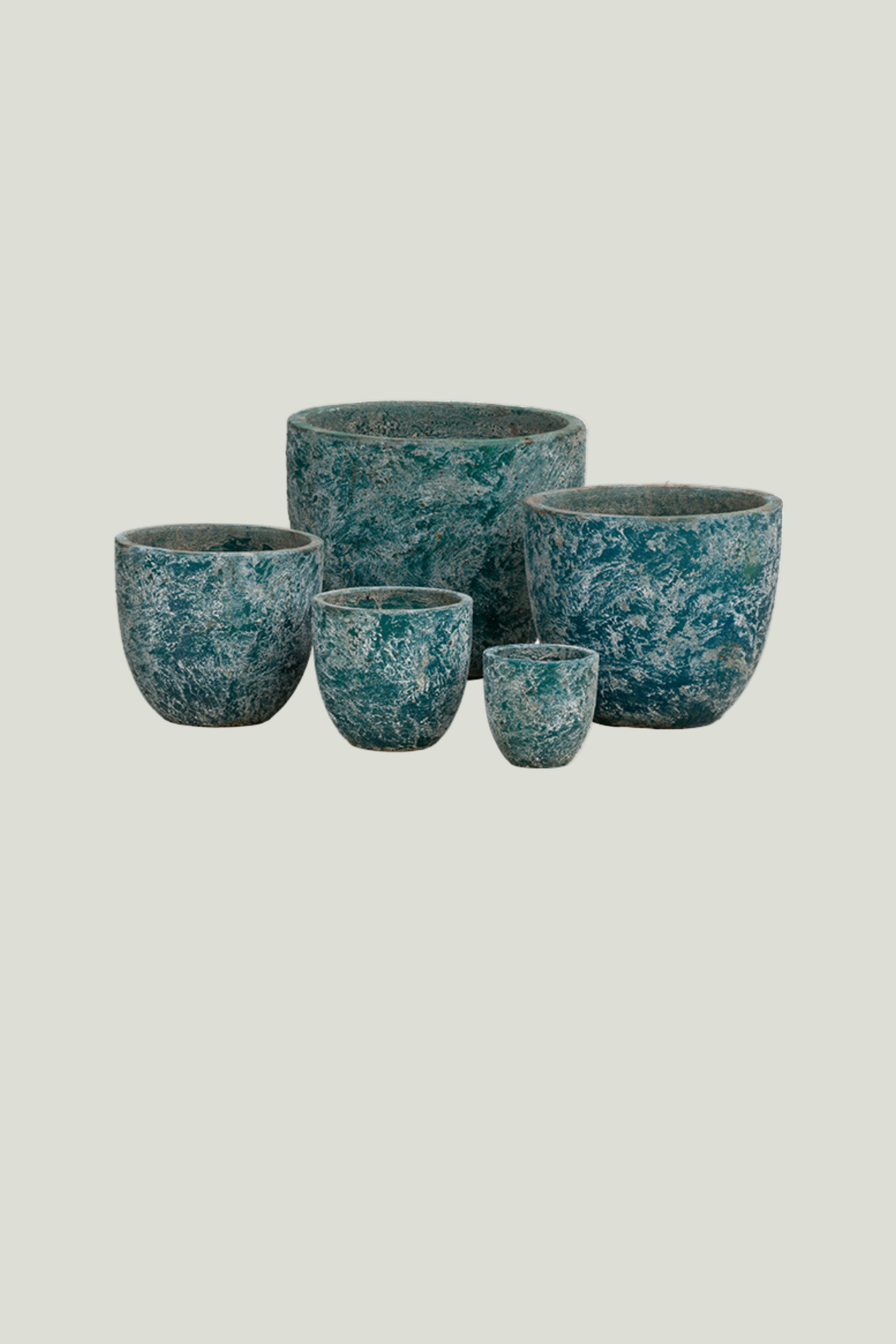 Set of five blue marbled ceramic pots of different sizes
