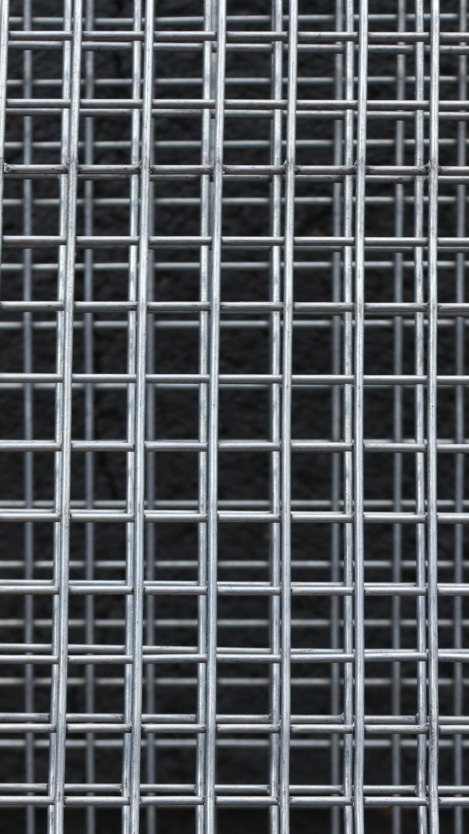 Metallic grid pattern on a black background
