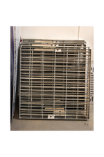 A stack of galvanised steel pit grates