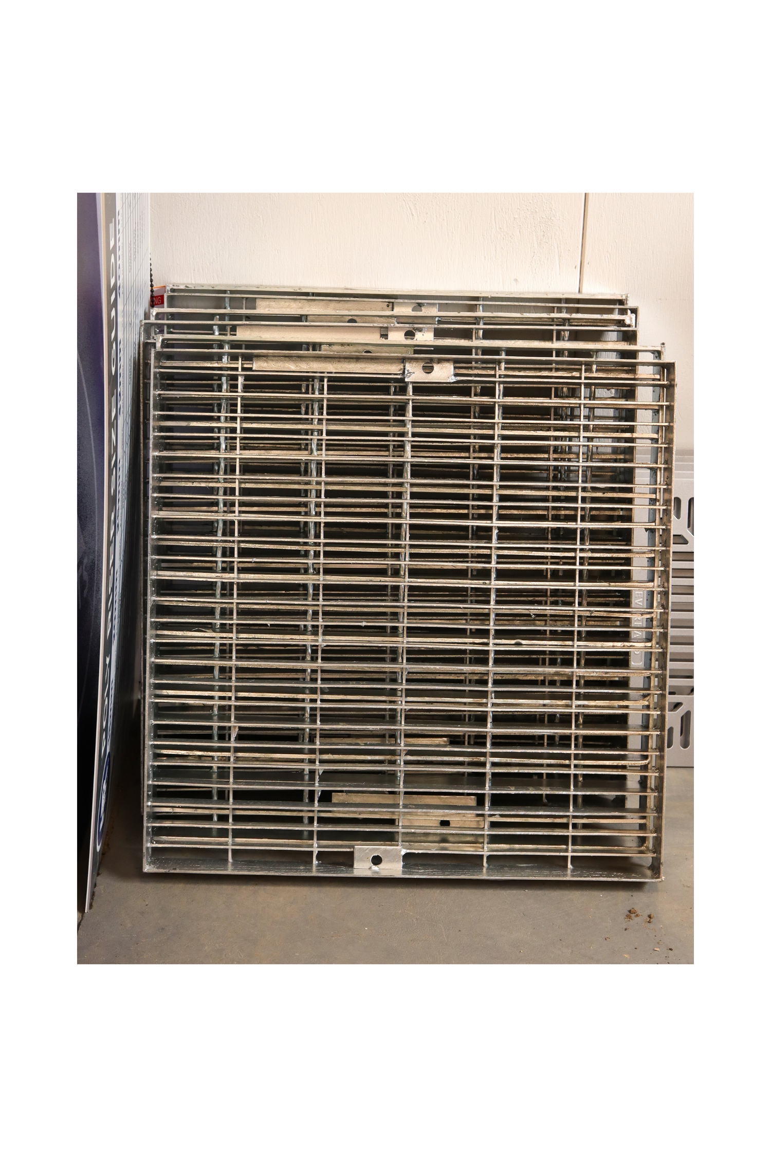 A stack of galvanised steel pit grates