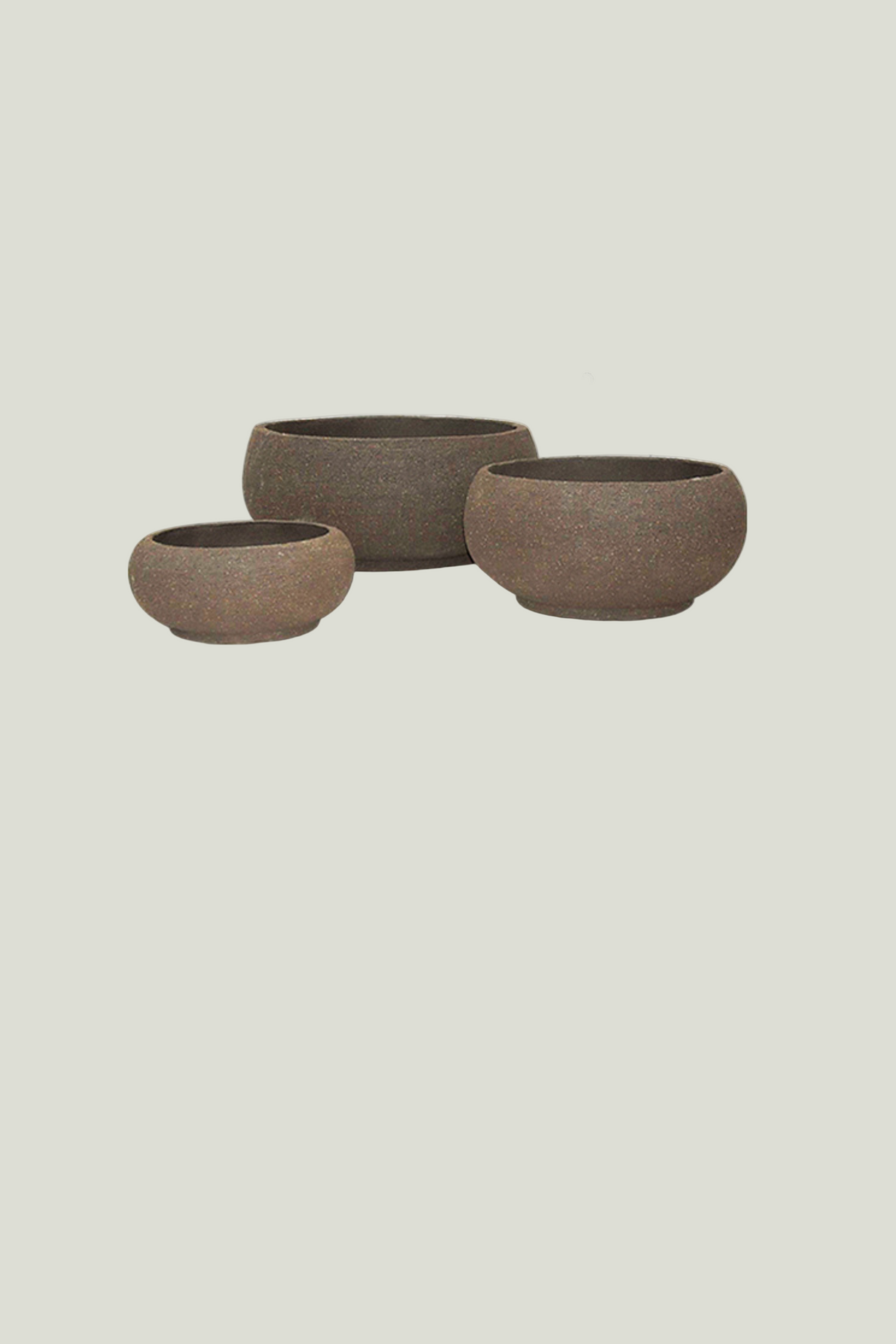 Three brown ceramic planter bowls of different sizes