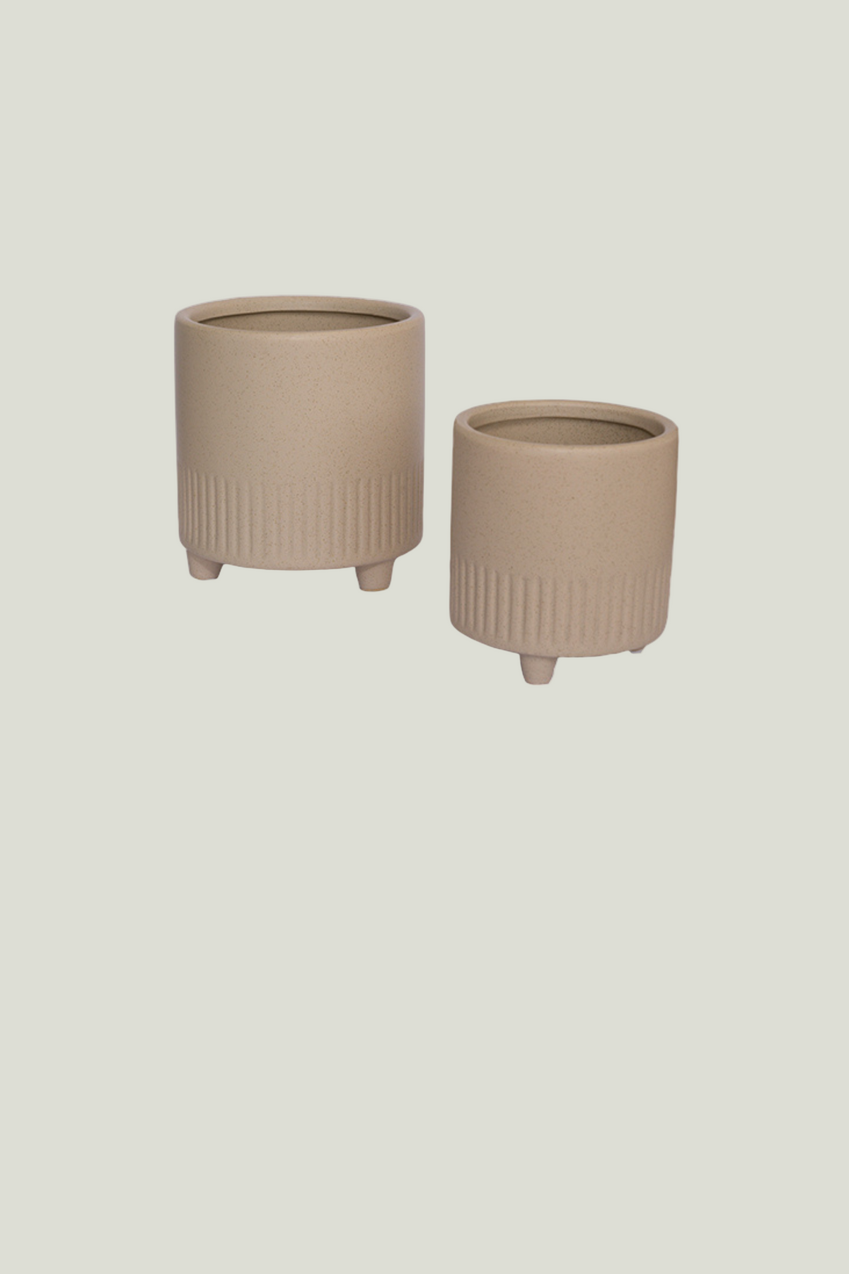 Two beigey ceramic planters with ribbed textur