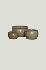 Three sandy ceramic bowls of different sizes