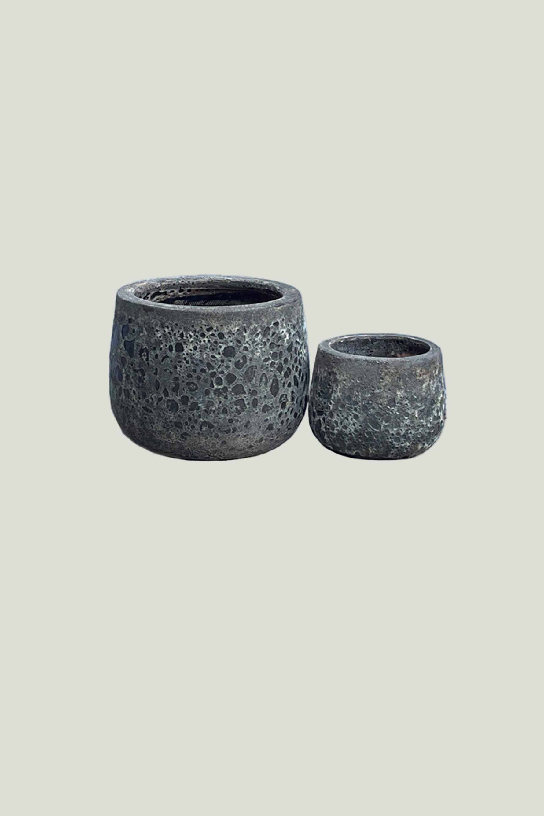 Two textured gray terracotta pots 
