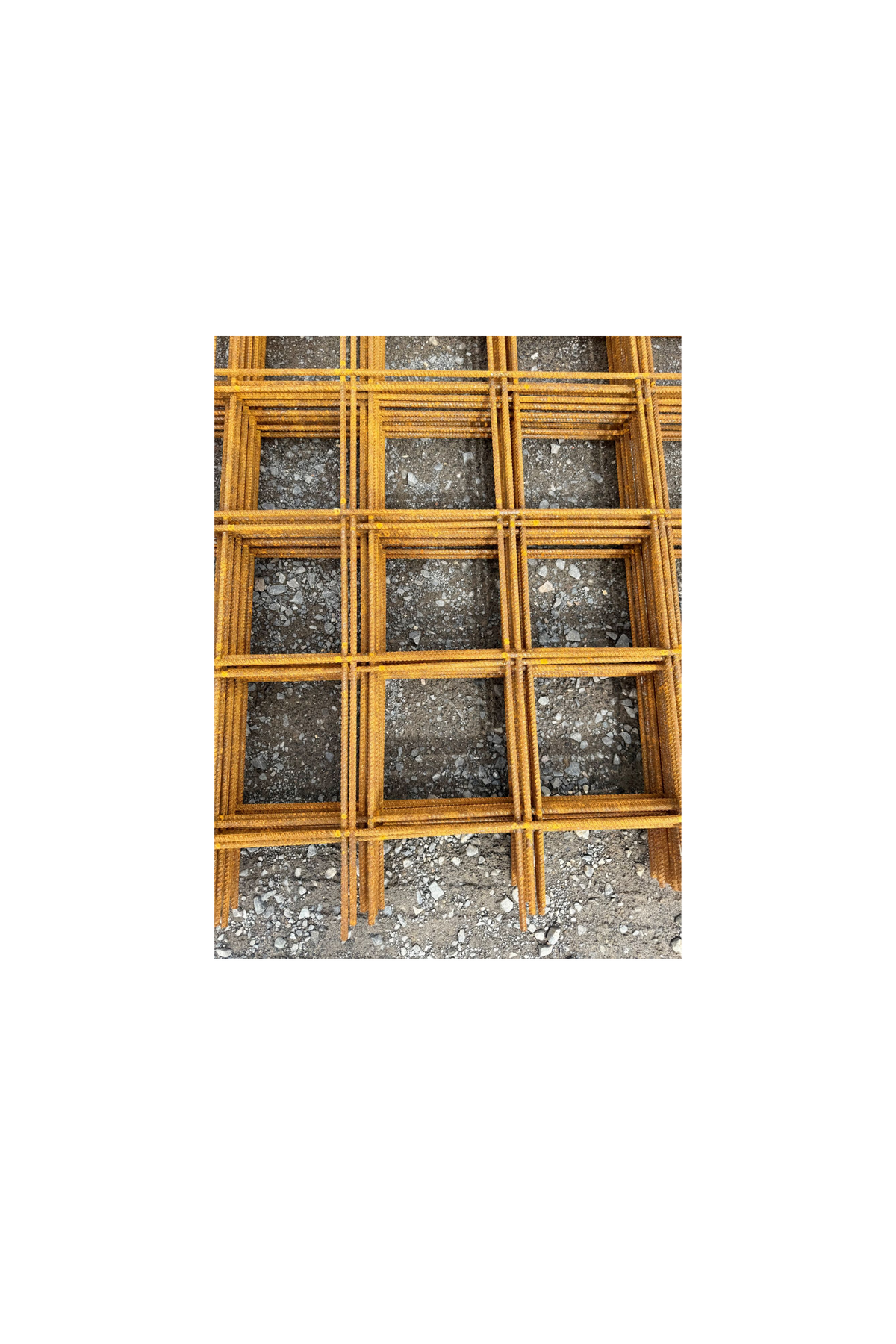 A stack of steel reinforcement mesh on crushed rock base