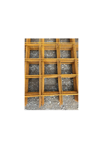 A stack of steel reinforcement mesh on crushed rock base