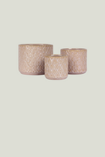 Three decorative pots with textured surfaces of different sizes
