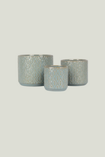 Three ceramic pots with textured design of different sizes